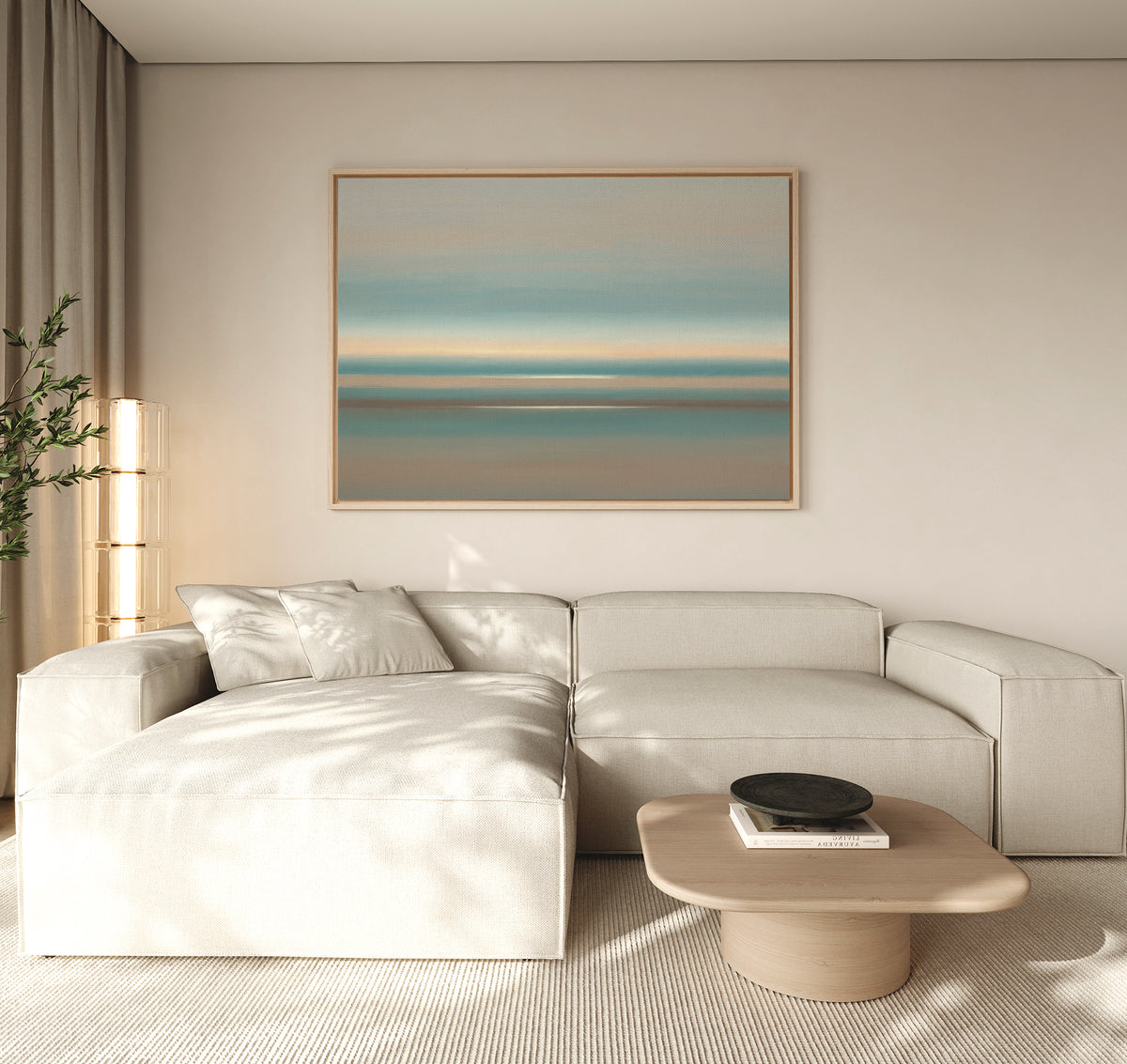 A modern living room with a light beige sectional, low wood coffee table, neutral decor, tall corner plant, and the Soft Tide Layers Canvas Art - Horizontal as coastal wall art creates a Nordic Park-inspired serene retreat.
