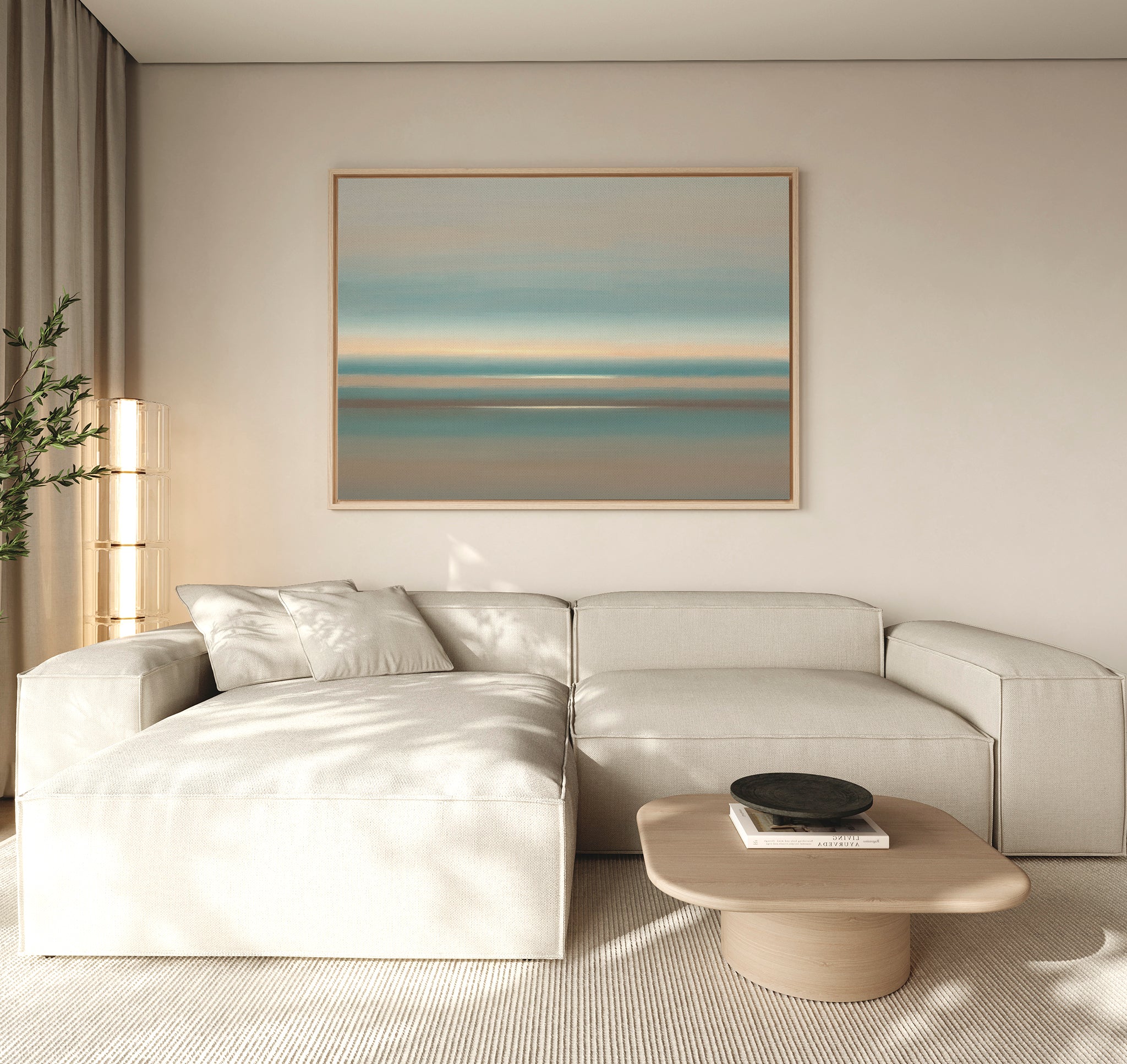 A modern living room with a light beige sectional, low wood coffee table, neutral decor, tall corner plant, and the Soft Tide Layers Canvas Art - Horizontal as coastal wall art creates a Nordic Park-inspired serene retreat.