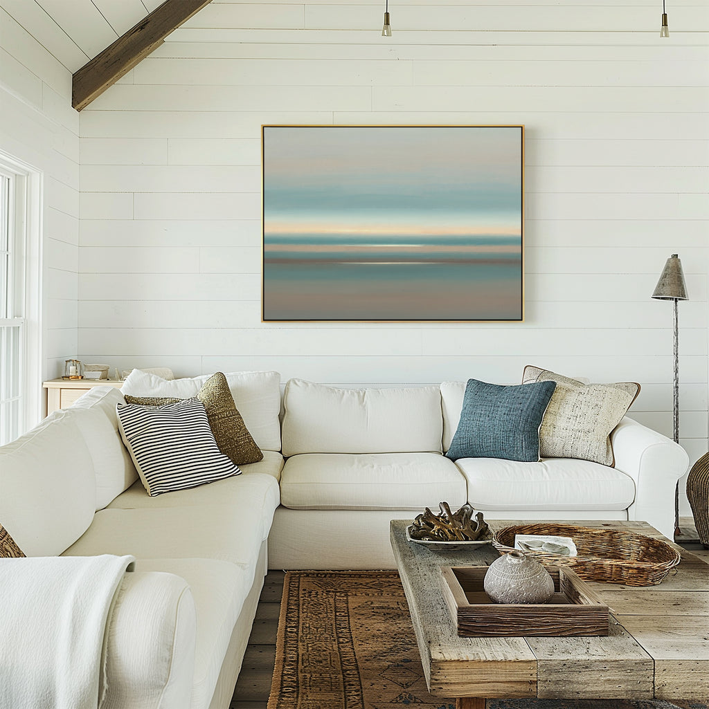 Bright living room with white shiplap walls, a large sectional sofa and assorted pillows, rustic wood coffee table with decor, and the Soft Tide Layers Canvas Art - Horizontal above the couch. Sunlight streams through the window.