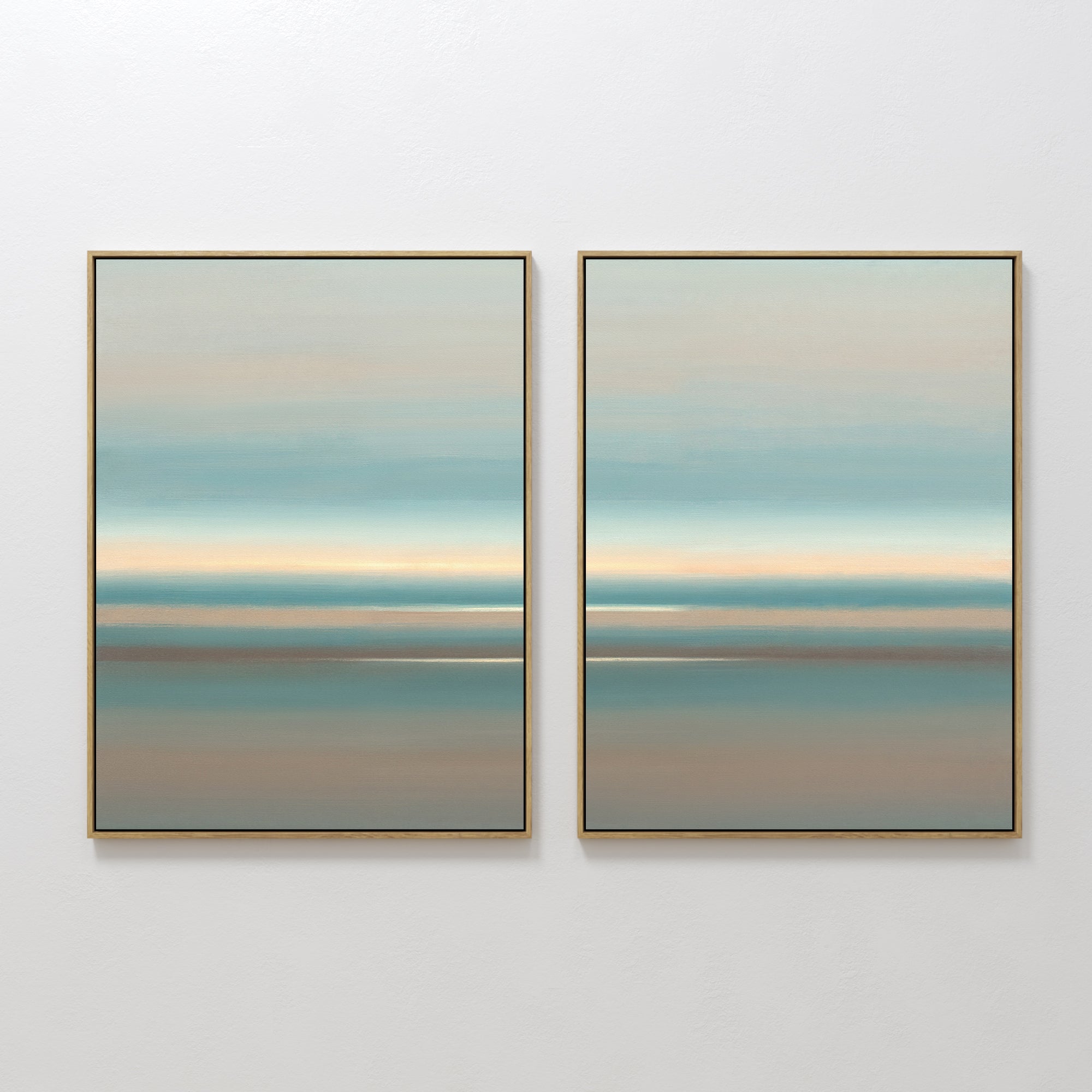 Soft Tide Layers - Set Of 2: Framed abstract prints featuring soothing horizontal bands in blue, beige, and tan evoke a tranquil seascape—ideal coastal wall art for any white wall.