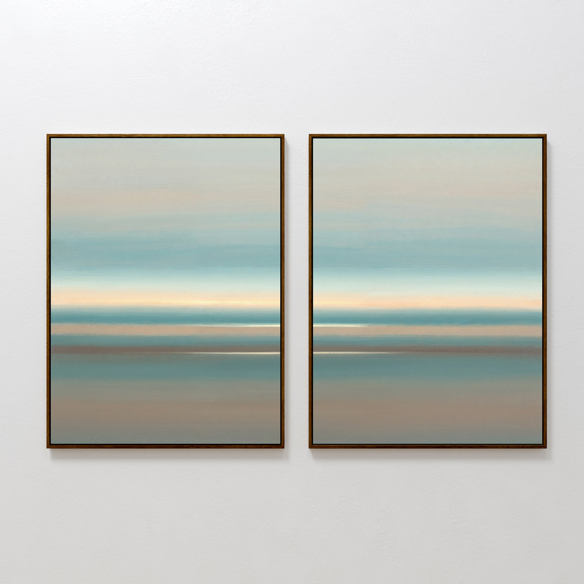 The Soft Tide Layers - Set Of 2 features two framed abstract prints with horizontal bands in soft blue, beige, and muted brown tones, creating a calming coastal wall art effect against a white wall.