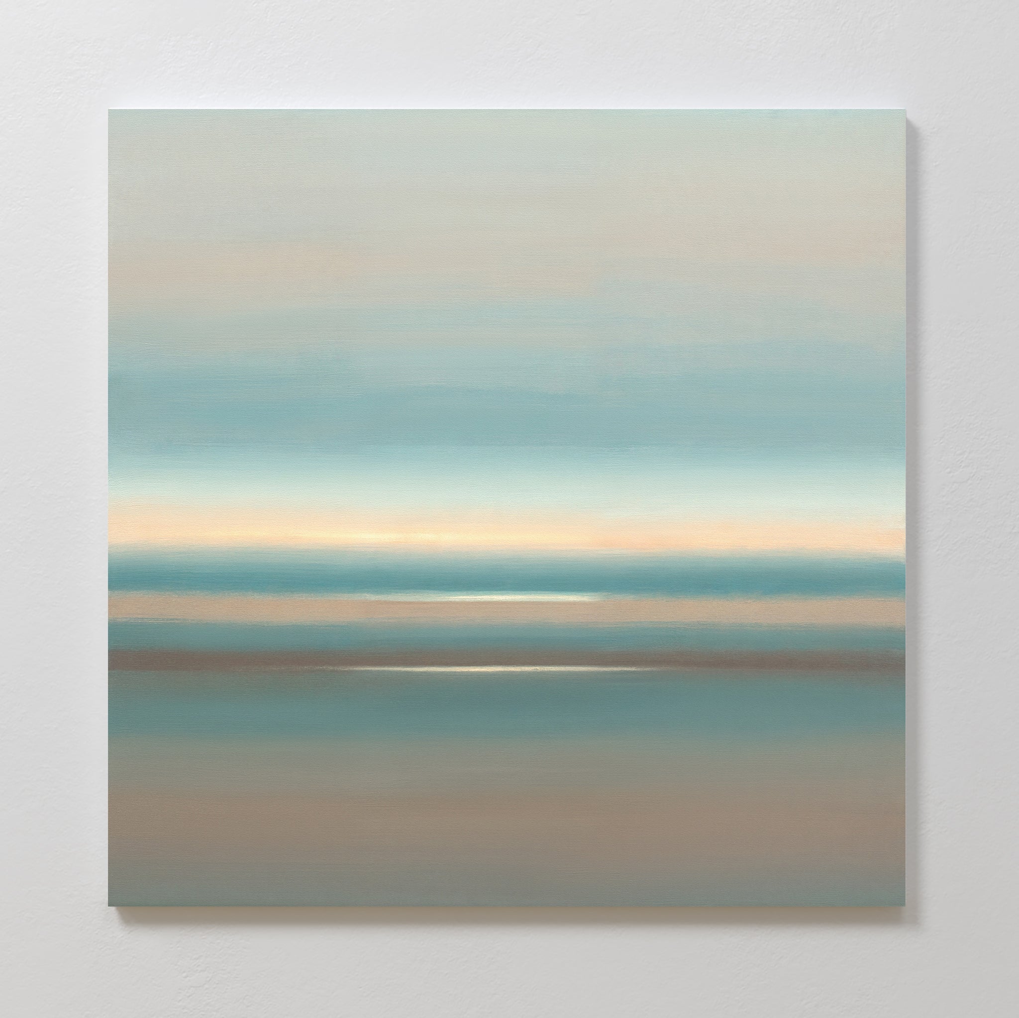 The Soft Tide Layers Canvas Art - Square features soft, horizontal bands of blue, beige, and brown for a tranquil, misty landscape vibe. This calming abstract print adds serene coastal style to any room when mounted on a light-colored wall.