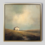 The Solitary House Canvas Art - Square features a weathered white farmhouse on a gentle hill, surrounded by open grassy fields under a softly lit beige and blue sky, bringing rustic charm to any space.