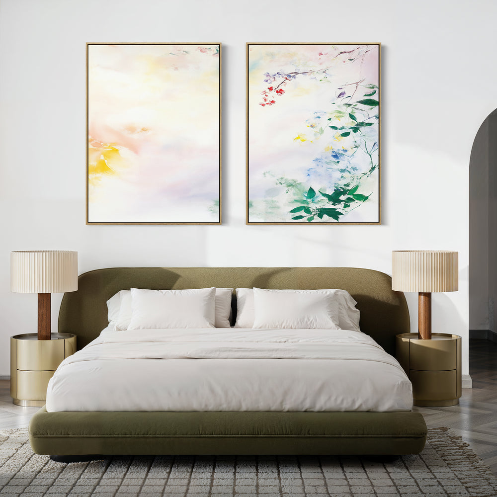 Modern bedroom with an olive green upholstered bed, white bedding, gold nightstands and lamps. Above the bed, the Spring Reverie - Set of 2 botanical canvas prints add charm to the neutral, minimalist space.