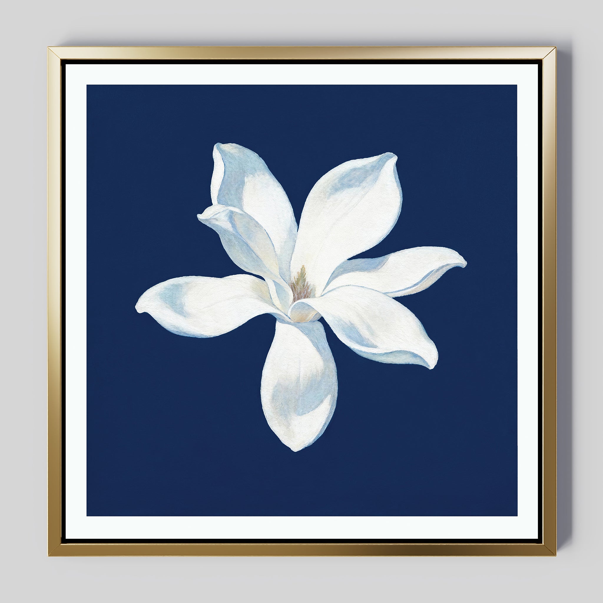 The Starlit Magnolia Canvas Art - Square features a white six-petal magnolia centered on dark blue with a gold frame, making it an ideal contemporary wall décor or canvas print for Nordic Park-inspired interiors.
