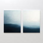 The Steel Harbor Mist - Set Of 2 features square seascape paintings in blue, gray, and white tones, with serene water and a hazy sky blending smoothly, perfect for adding a calming touch to any white wall.