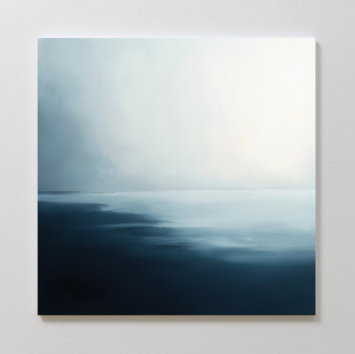 Steel Harbor Mist Canvas Art - Square features a minimalist seascape with smooth gradients of dark blue water blending into a soft gray and white sky—ideal wall art for adding a serene, tranquil touch to any room.