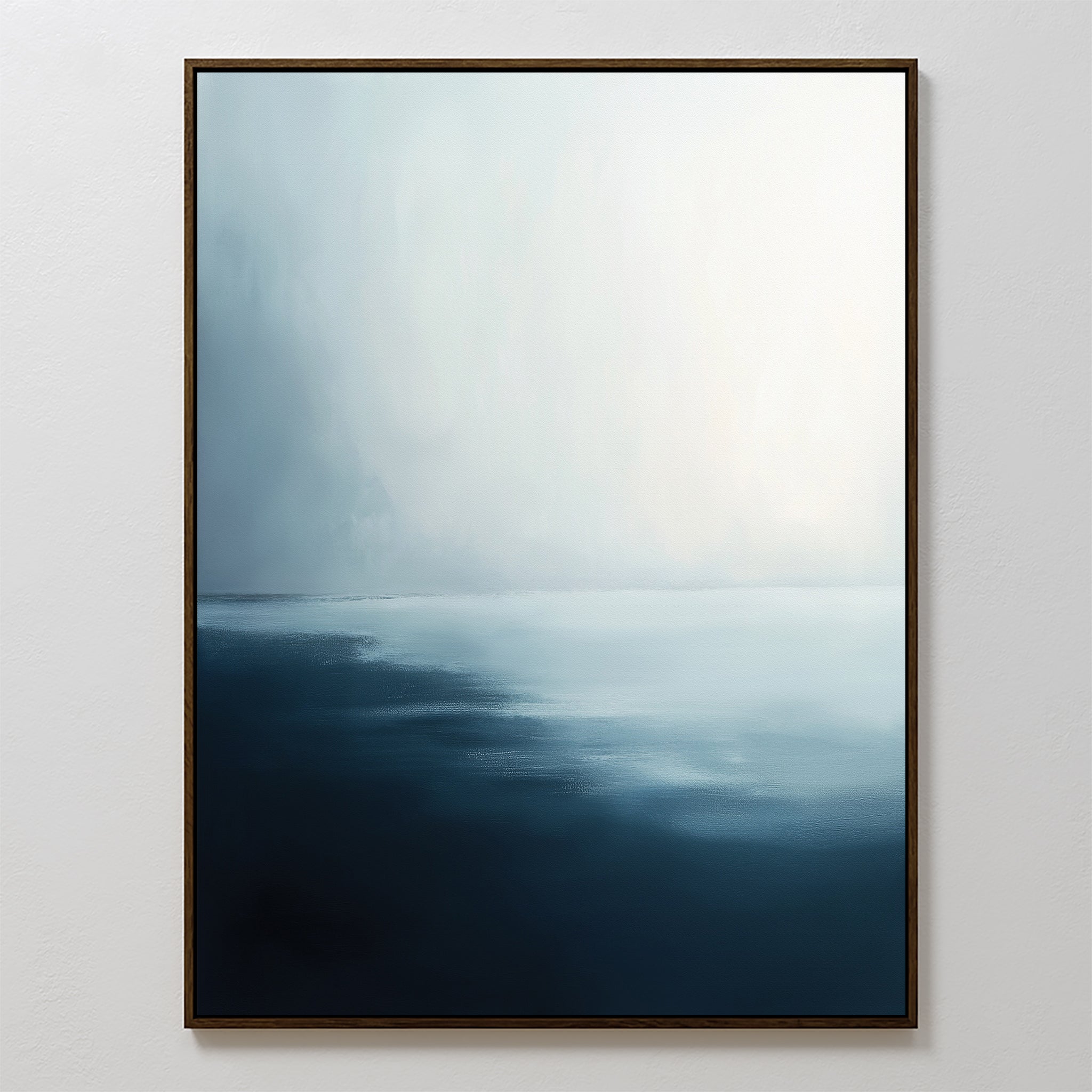 Steel Harbor Mist Canvas Art - Vertical features an abstract gradient from deep blue to pale blue and white, evoking a misty seascape. Perfect for a serene living room, it comes framed with a slim, dark border.