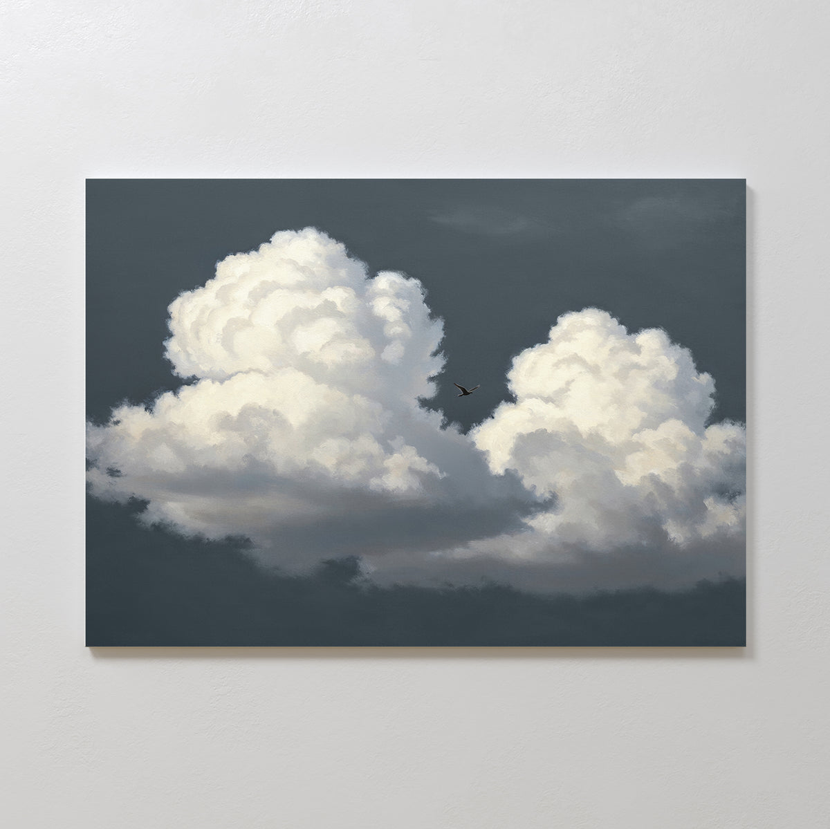 The Storm Passage Canvas Art - Horizontal features two large, fluffy white clouds in a dark gray sky with a small airplane flying between them, displayed on a light-colored wall.