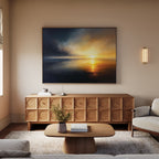 A cozy living room with a beige sofa, light wood coffee table, and textured wood sideboard. Above the sideboard hangs the Storm's Edge Canvas Art - Horizontal, while a modern wall sconce provides soft lighting.