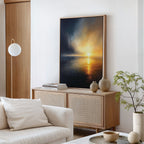 A modern minimalist living room showcases a light wood sideboard, vases, stacked books, and a potted plant. Above the white sofa with beige pillows hangs the Storm's Edge Canvas Art - Vertical, bringing atmospheric wall art to the space.