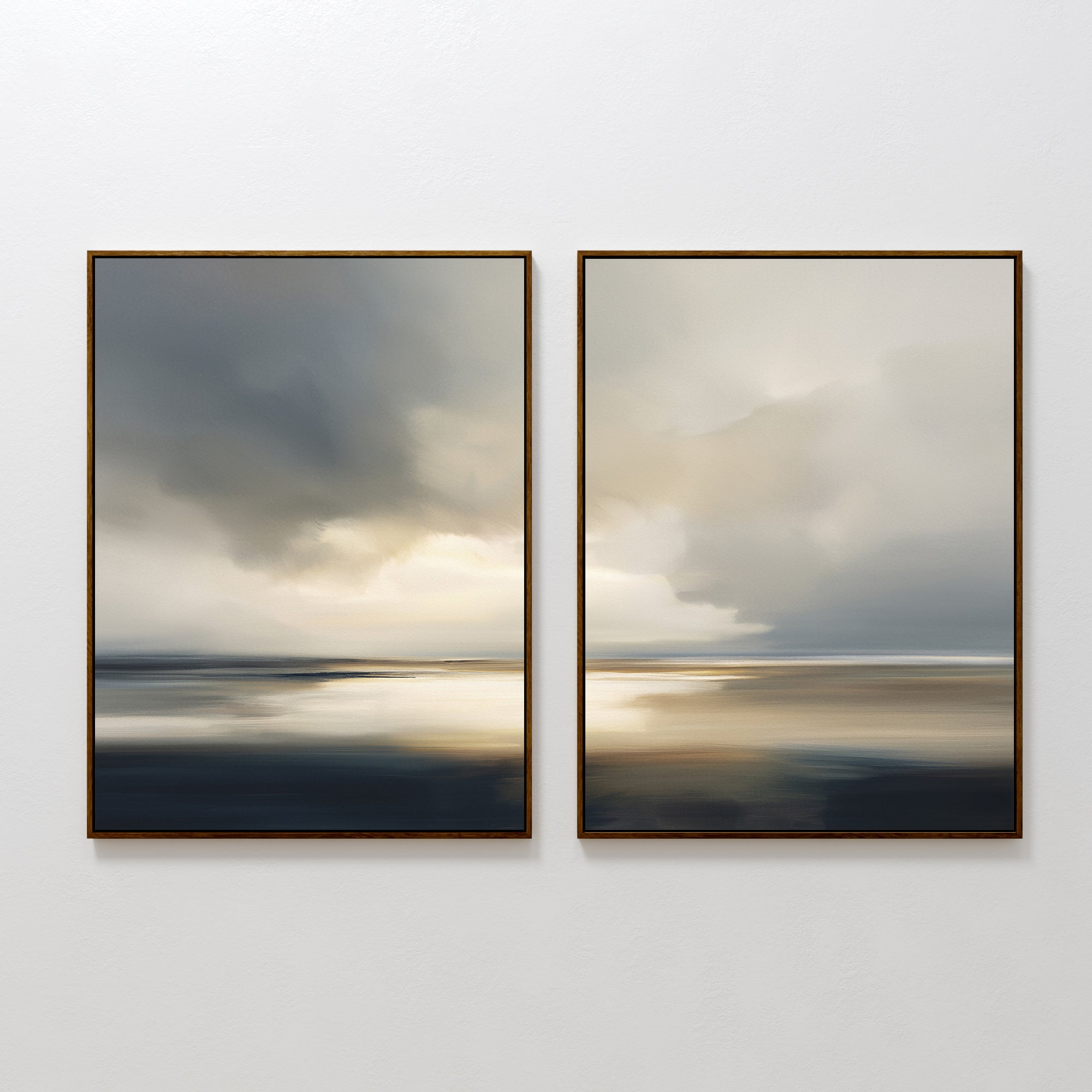The "Stormy Tides - Set Of 2" features framed coastal wall art with moody seascapes—dark clouds, soft light, and blurred reflections over water in blue, gray, and beige tones—hung side by side on a white wall.