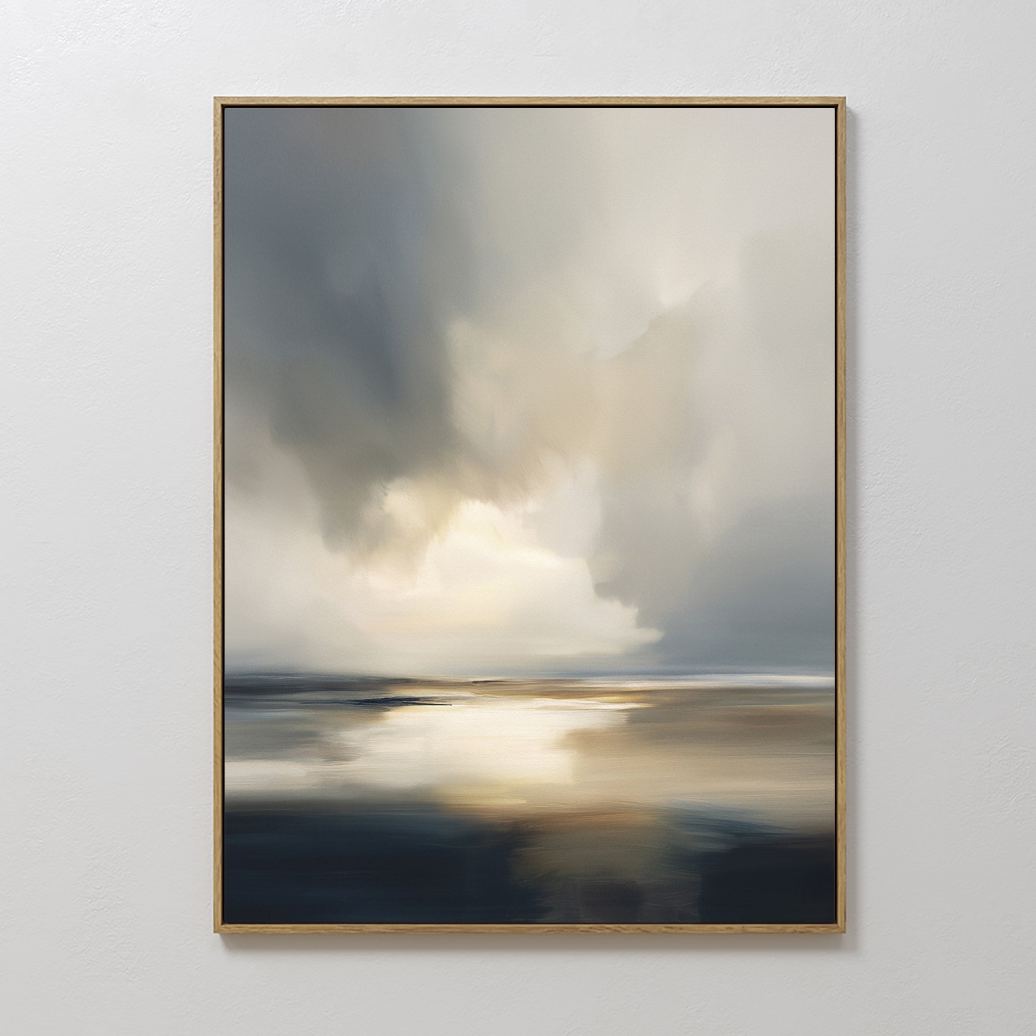 The Stormy Tides Canvas Art - Vertical, featuring soft gray, cream, and gold tones that evoke a seascape or sky on water, hangs on a white wall—an elegant Nordic Park-inspired accent for any space.