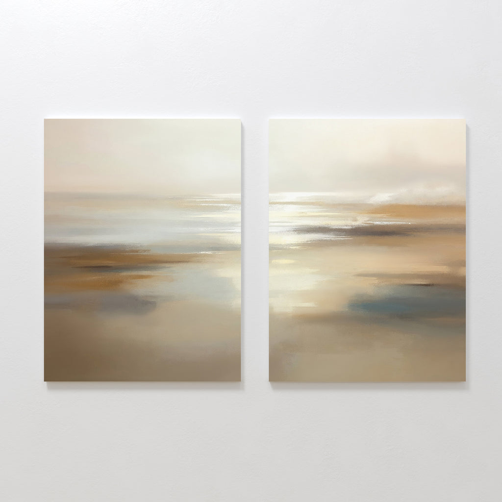 Sunlit Waters - Set Of 2: Two abstract canvas paintings with soft, blurred tones of beige, tan, white, and blue. This serene wall art duo evokes gentle reflections and sunlit waters, ideal for creating a calming atmosphere in your space.