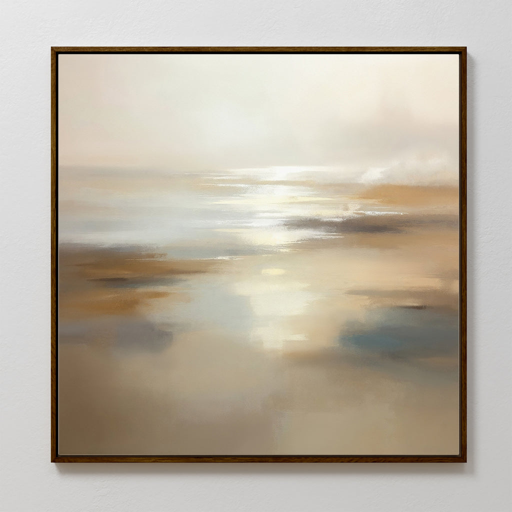 The Sunlit Waters Canvas Art - Square is a framed abstract painting that captures a serene beach scene with soft beige and cream tones, reflecting light over water and sand beneath a hazy sky.