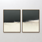 The Tempest Brewing - Set Of 2 features two abstract paintings with dark gray blending into white and beige tones, each framed in slim wooden frames and mounted together for striking wall art.