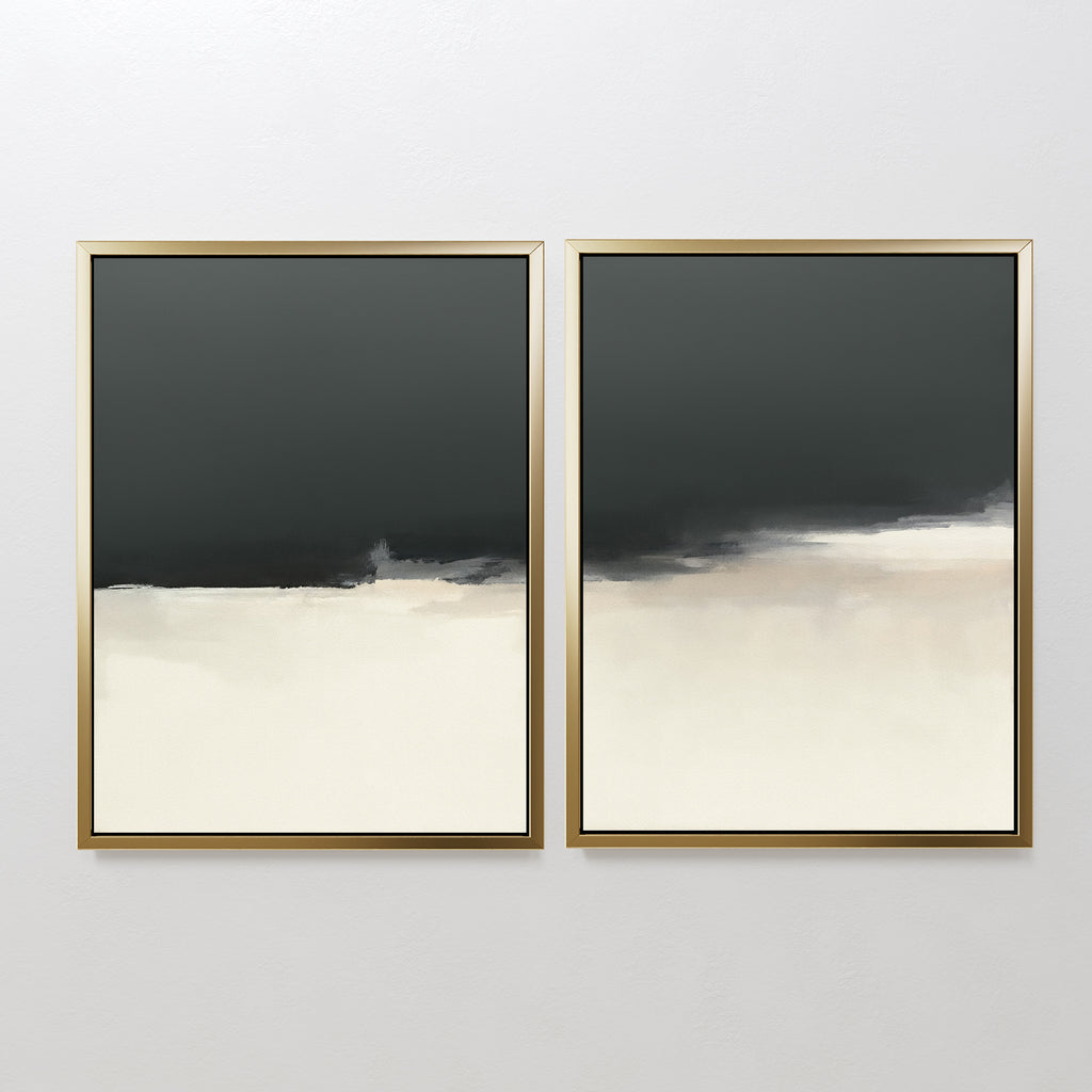 The Tempest Brewing - Set Of 2 features two abstract artworks with gold frames, each showcasing dark gray tops fading into beige and off-white bottoms, creating a minimalist and atmospheric wall art statement.