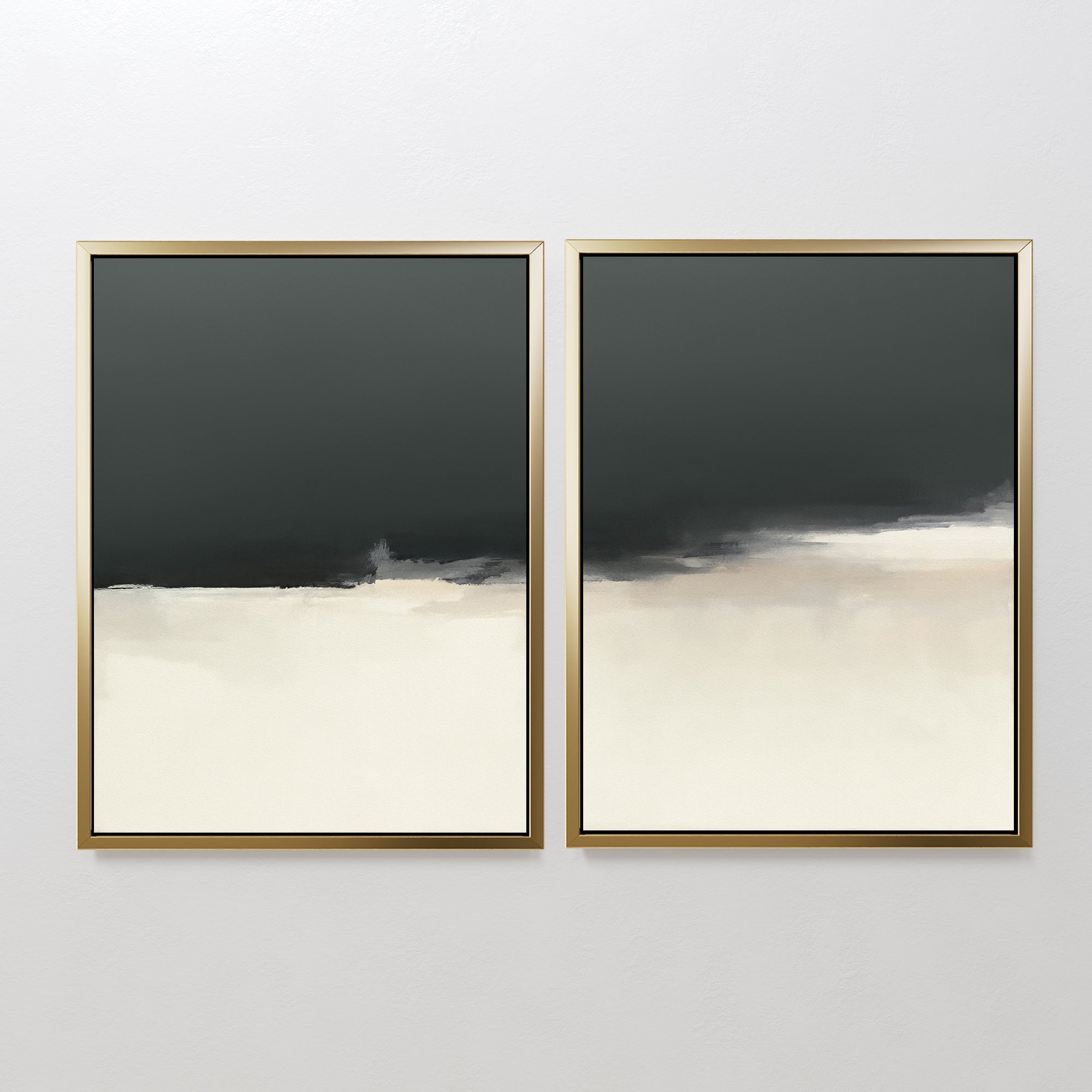 The Tempest Brewing - Set Of 2 features two abstract artworks with gold frames, each showcasing dark gray tops fading into beige and off-white bottoms, creating a minimalist and atmospheric wall art statement.