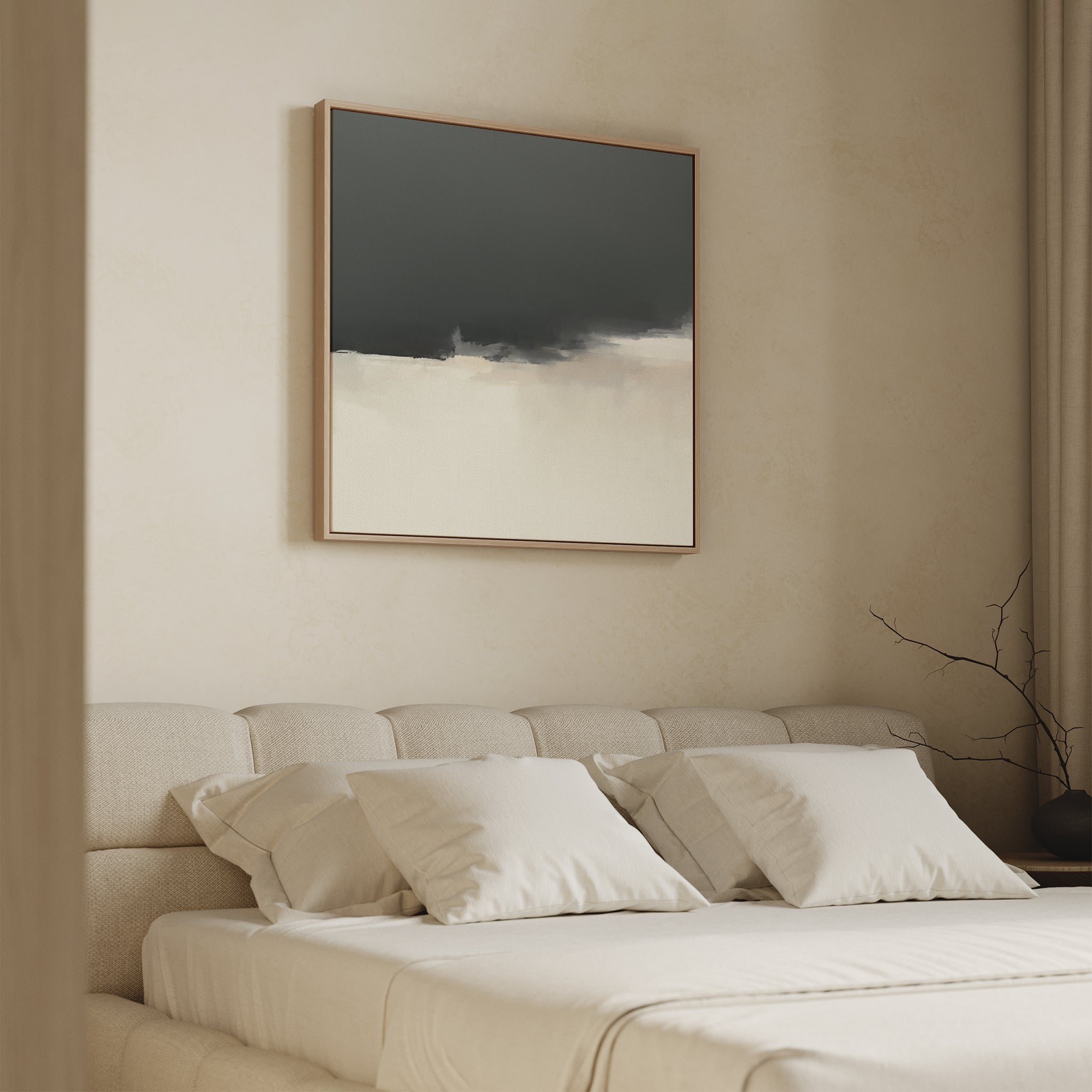 A minimal bedroom with a beige upholstered bed, white bedding, and light walls features the Tempest Brewing Canvas Art - Square in dramatic tones above the bed. A bare branch sits on a side table near beige curtains.
