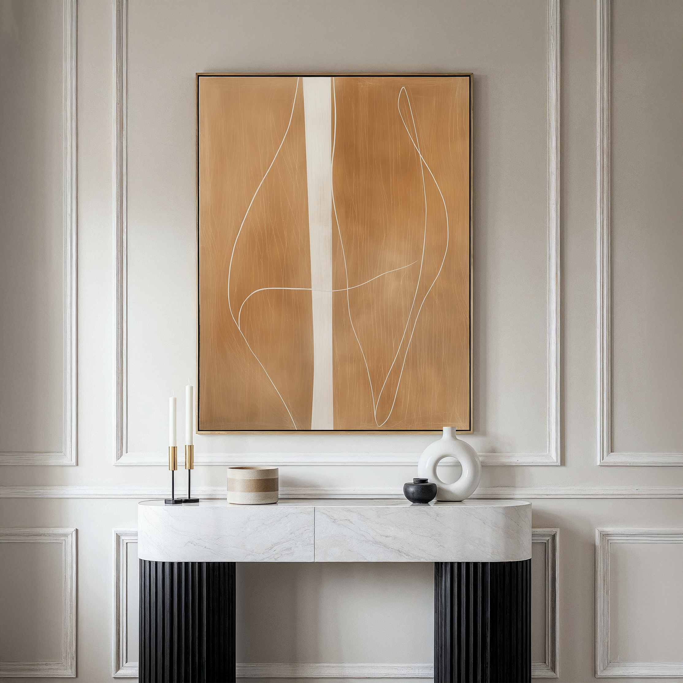A modern console table with a marble top displays minimalist decor against a paneled wall. Above it hangs the Soft Brown Flow Abstract Canvas Art, in tan and white, perfect for elevating your living room style.