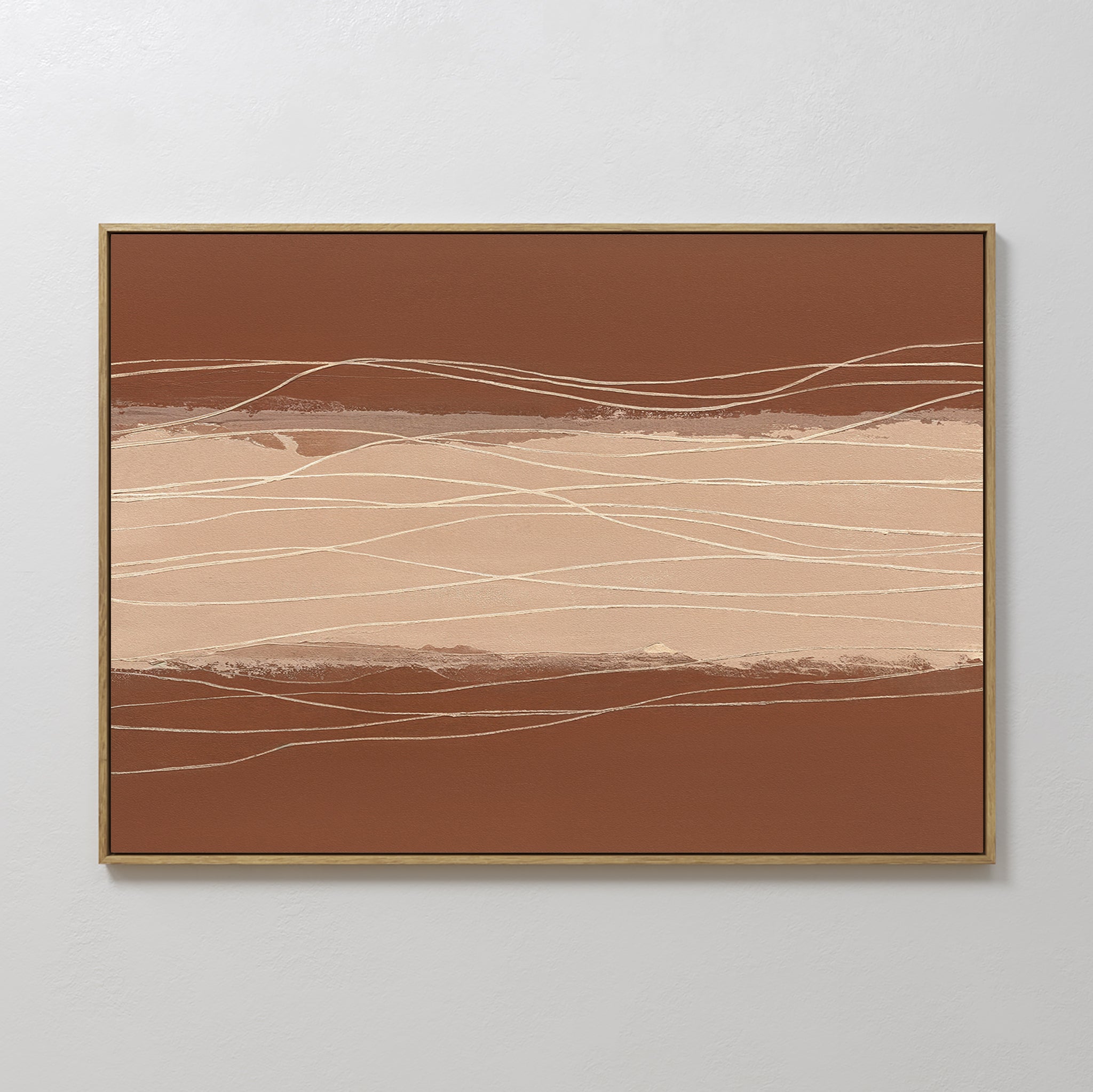 Terracotta Currents Canvas Art - Horizontal features abstract brown and beige bands with thin, wavy white lines. It comes framed in a slim gold border and looks striking against a white wall.