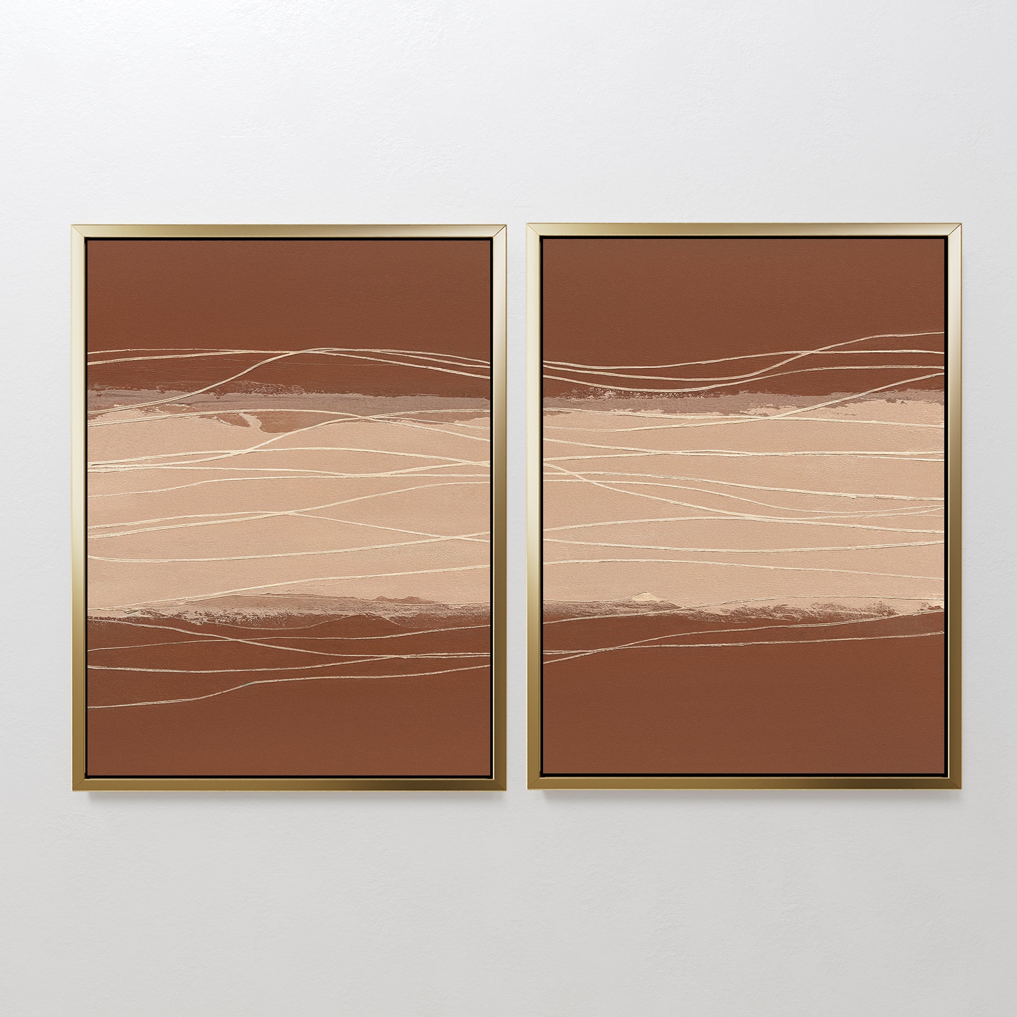 The "Terracotta Currents - Set Of 2" features abstract paintings with brown and beige horizontal bands and thin, wavy white lines. Each piece is framed in light wood and displayed side by side on a white wall for a modern touch.