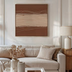 A modern living room with a beige sofa, neutral pillows, and Nordic Park-themed decor features the Terracotta Currents Canvas Art - Square in brown and beige tones. A wooden side table, white lamp, and vase with dried flowers complete the look.