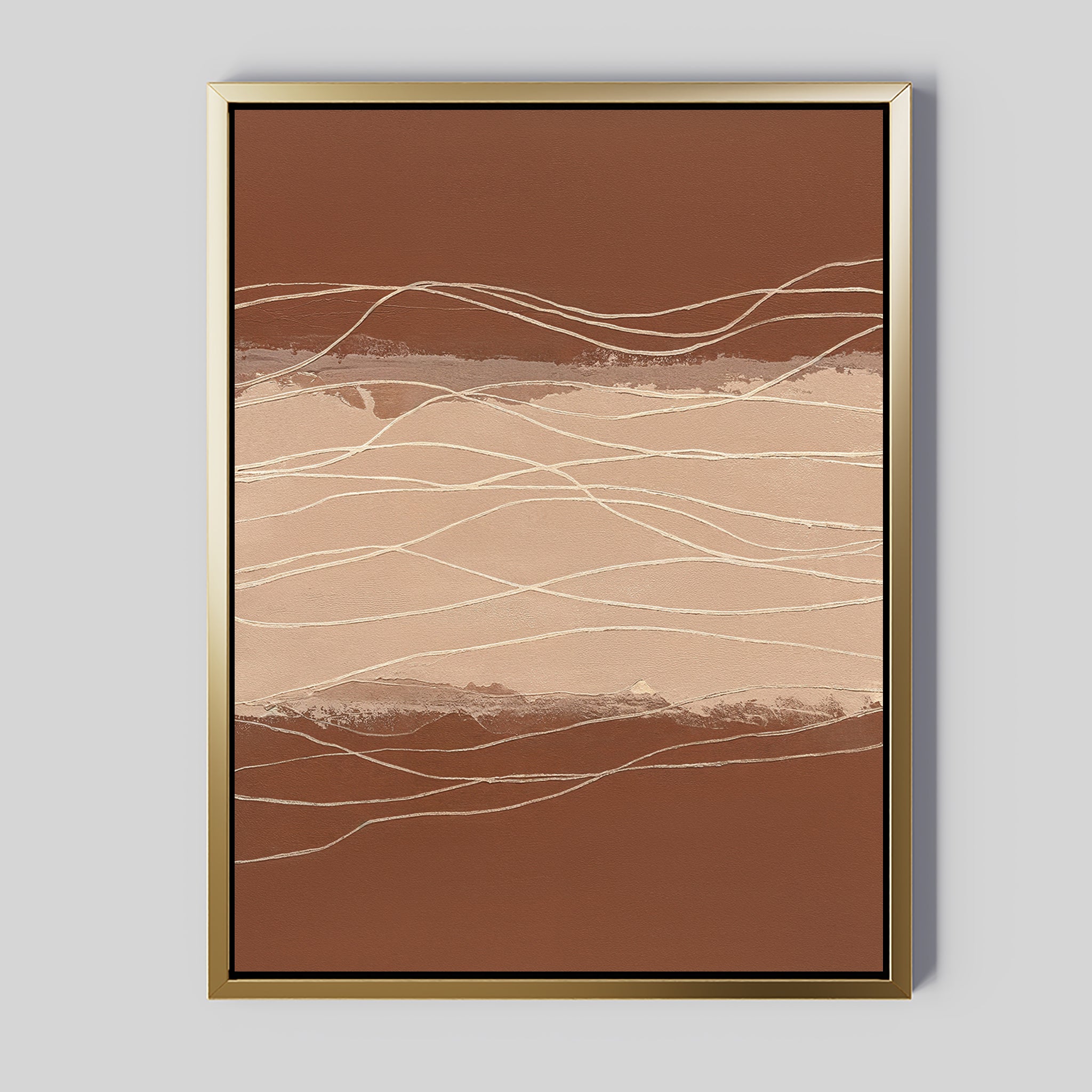 The Terracotta Currents Canvas Art - Vertical features wavy cream and beige lines on a brown background, resembling a landscape. Displayed in a gold frame, it creates a stylish contemporary statement on any light gray wall.