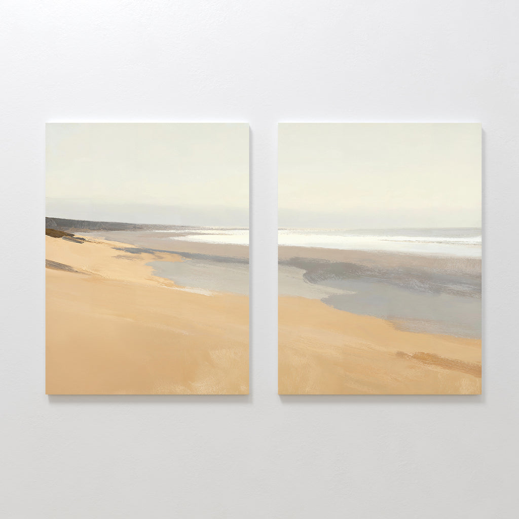 Tidal Meditation - Set of 2 features minimalist paintings of a sandy beach with gentle waves and a soft sky. Displayed together, this calming coastal canvas print adds tranquil decor to any space.