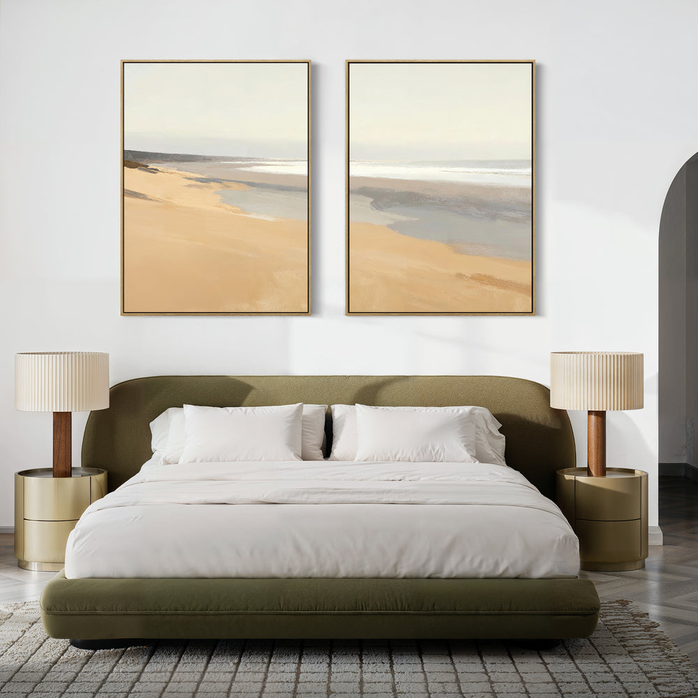 A modern bedroom with an olive green upholstered bed, white bedding, two beige nightstands with matching lamps, and tranquil decor featuring the "Tidal Meditation - Set of 2" coastal canvas prints above the bed.