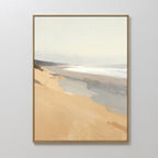 The Tidal Meditation Canvas Art – Vertical features a serene beach with sandy shores and soft waves under a pale sky in muted tones, displayed on a white wall for a calming coastal touch.