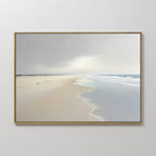The Tidal Reflections Canvas Art - Horizontal features a serene beach scene with wet sand, gentle waves, and a cloudy sky in muted tones, making it ideal minimalist wall decor for a calming touch on any white wall.