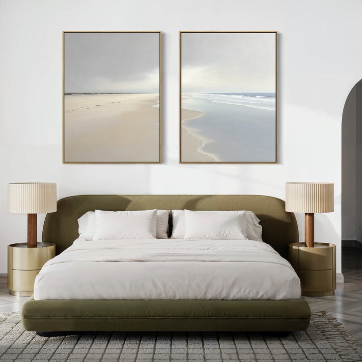 A modern bedroom with an olive green bed, white bedding, two beige nightstands with matching lamps, and calming Tidal Reflections - Set of 2 ocean art above the bed on a white wall.