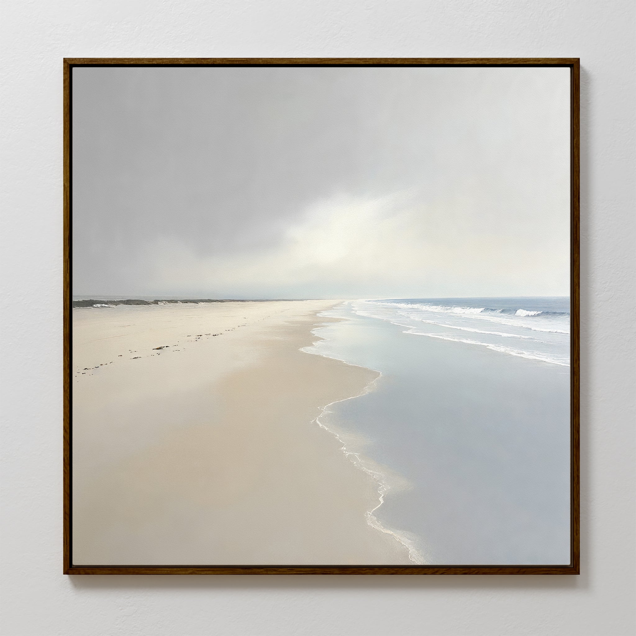 The Tidal Reflections Canvas Art - Square features a peaceful, empty beach with gentle waves and soft sand under a bright, cloudy sky—ideal as calming wall decor for any room.