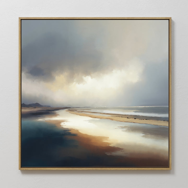Tidal Reverie Canvas Art - Square: A framed canvas print featuring a tranquil beach under a cloudy sky with light reflecting on wet sand and calm water—ideal coastal wall art to create a serene space.