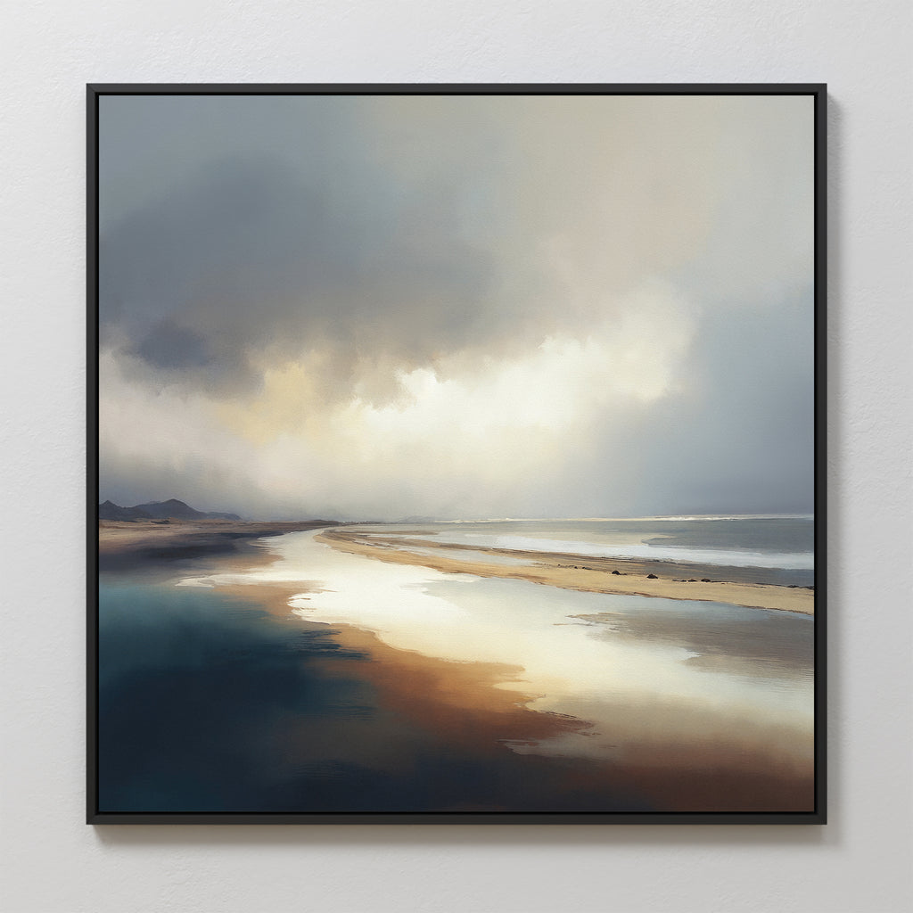 The Tidal Reverie Canvas Art - Square features a framed coastal scene with dramatic clouds, sunlit wet sand, gentle waves, distant hills, and a moody sky in muted blues, grays, and warm browns.