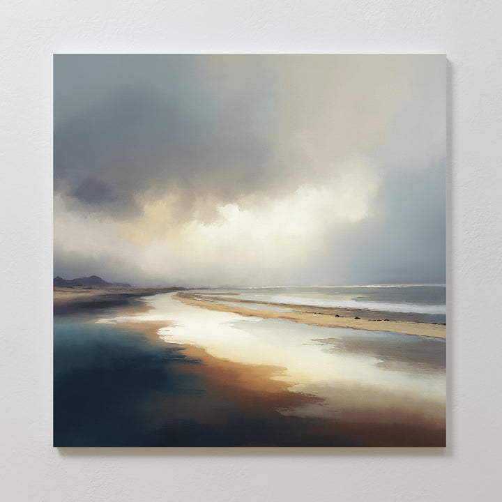 The Tidal Reverie Canvas Art - Square features a tranquil cloudy sky above a calm shoreline, with soft sunlight on wet sand and water—ideal for adding a peaceful, airy touch to any Nordic Park-inspired space.