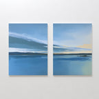 The Tranquil Reflections - Set of 2 features two calm blue seascapes with dark horizons and soft clouds fading to pale yellow, bringing serene Nordic Park-inspired beauty into your space as a tranquil canvas print.