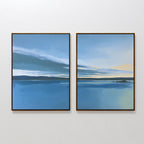 The "Tranquil Reflections - Set of 2" features framed landscape art of a peaceful blue lake, distant shorelines, and a soothing sky in blue and yellow hues—evoking a serene sunrise or sunset over water.