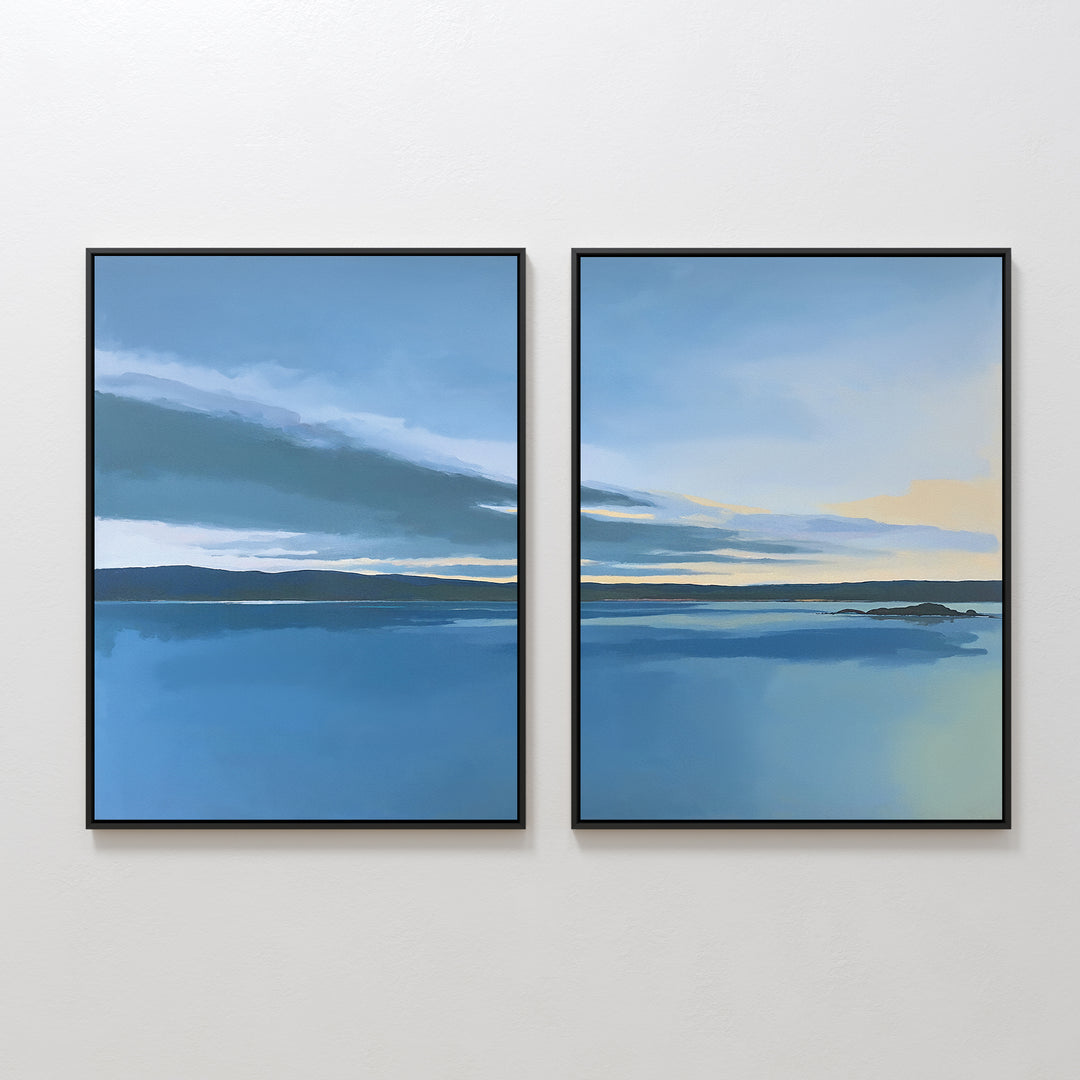 The "Tranquil Reflections - Set of 2" features two framed prints depicting serene blue seascapes with dark horizons, soft clouds, and touches of yellow sky, perfectly capturing a peaceful coastal scene for your space.