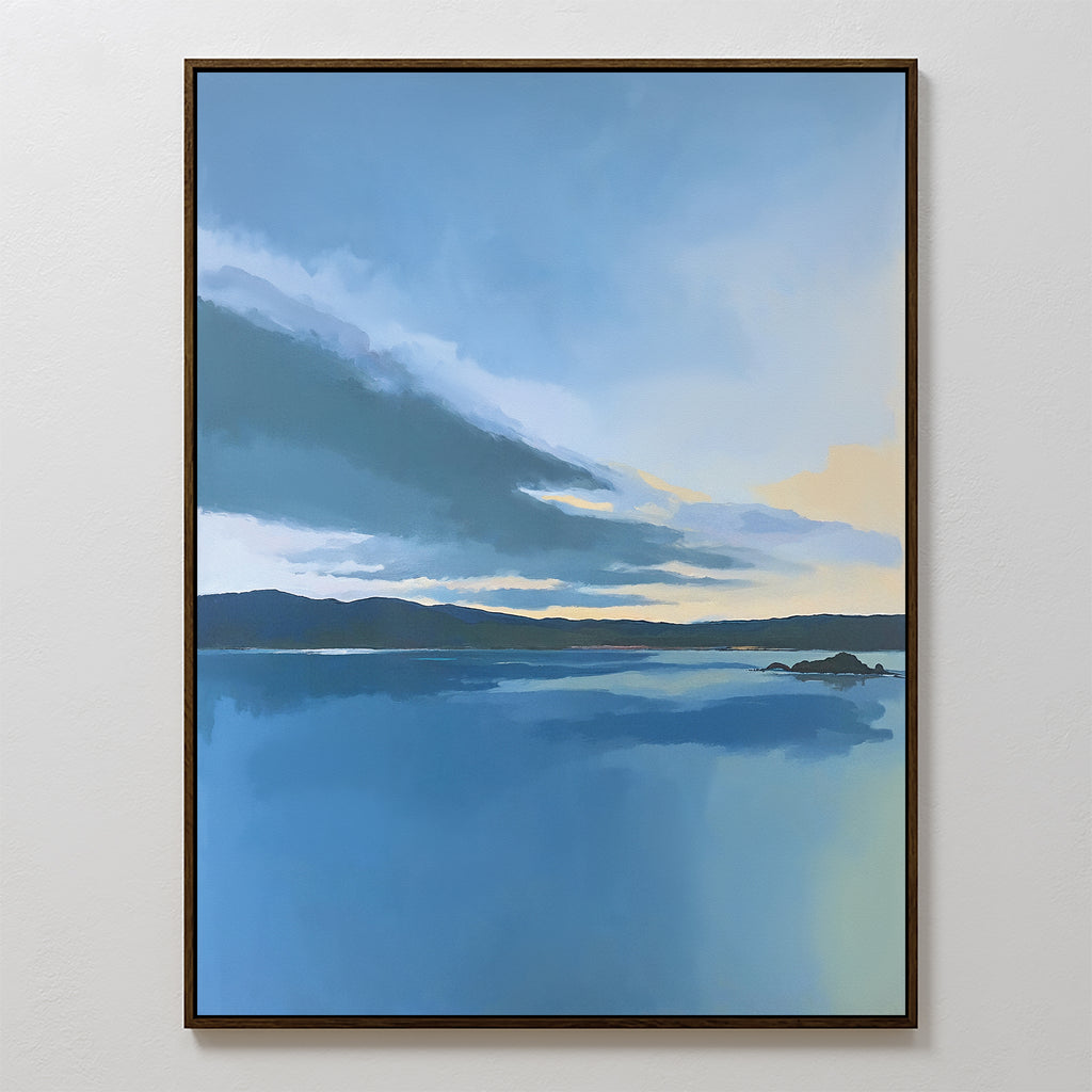 Tranquil Reflections Canvas Art - Vertical captures a peaceful lake reflecting a blue sky, soft clouds, and distant hills with touches of sunlight—an ideal serene wall art piece for your space.