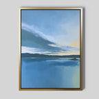 The "Tranquil Reflections Canvas Art - Vertical" features a serene blue lake with distant hills and a dramatic sky, soft clouds, and sunlight near the horizon, creating calming wall art for any light gray wall.