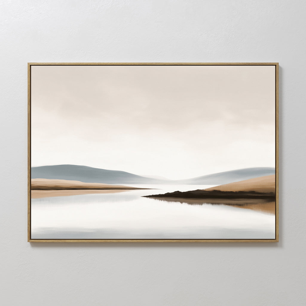 The Tranquil Waters Canvas Art - Horizontal features a serene lake with gentle hills in soft neutral tones, reflecting a muted sky. This minimalist landscape adds a calm, tranquil atmosphere to any space.