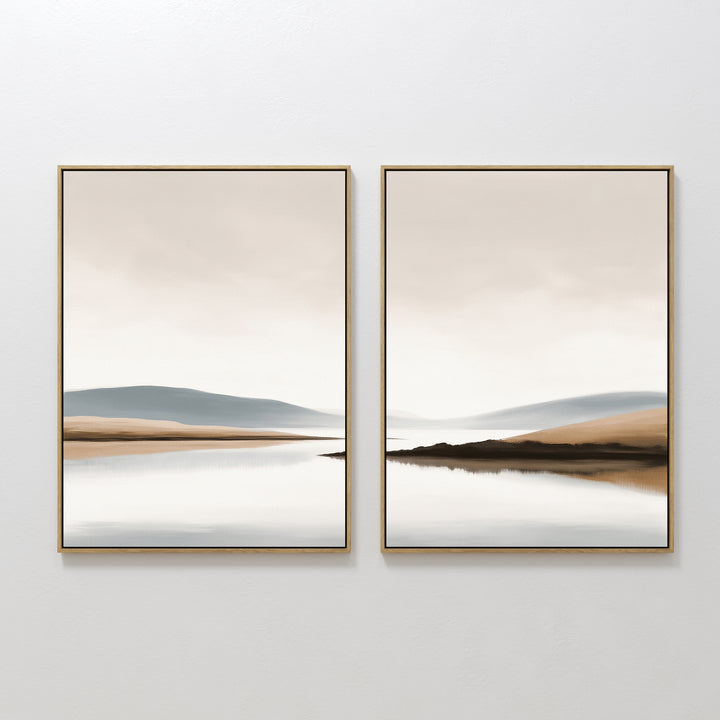 Tranquil Waters - Set of 2: Minimalist misty lakeside paintings in gold frames, featuring beige, blue, and gray tones. Calm water and distant hills beneath a peaceful sky—ideal serene wall art for modern spaces.