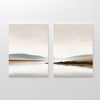 Tranquil Waters - Set of 2 features minimalist lakeside landscapes in beige, blue, and gray, with calm water and muted hills reflecting a cloudy sky—perfect serene wall art to create a peaceful atmosphere in any space.