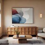 A cozy living room with a light wood cabinet, the Translucent Petals Canvas Art - Horizontal above it, a beige sofa, wooden coffee table with a vase of flowers, and soft natural lighting in a minimalist modern décor.