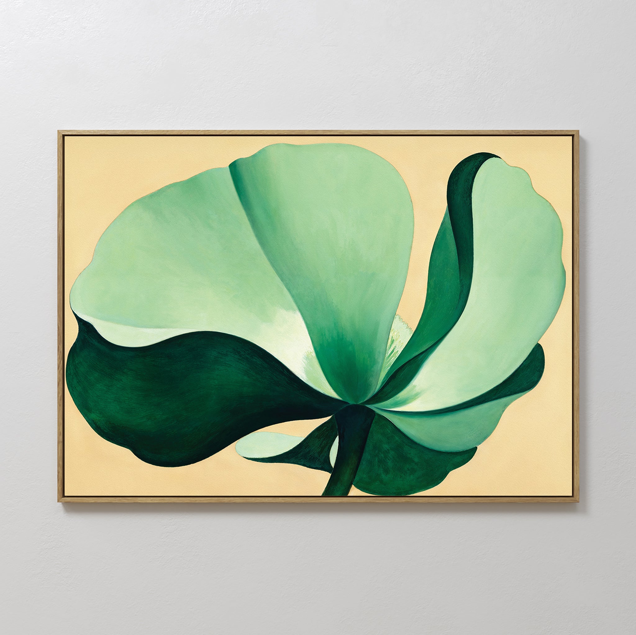 Tropical Serenity Canvas Art - Horizontal features a large, stylized green flower with layered petals on a light beige background in a thin gold frame—ideal neutral wall decor for any modern space.