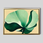 Tropical Serenity Canvas Art - Horizontal: A framed abstract green flower with large petals on a light beige background, ideal as neutral wall decor, displayed on a plain gray wall.