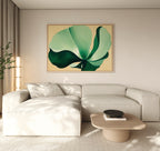 A modern living room with a light beige sectional sofa, a wooden coffee table, and the Tropical Serenity Canvas Art - Horizontal as neutral wall decor. Soft natural light enters from the left, with a plant in the corner.