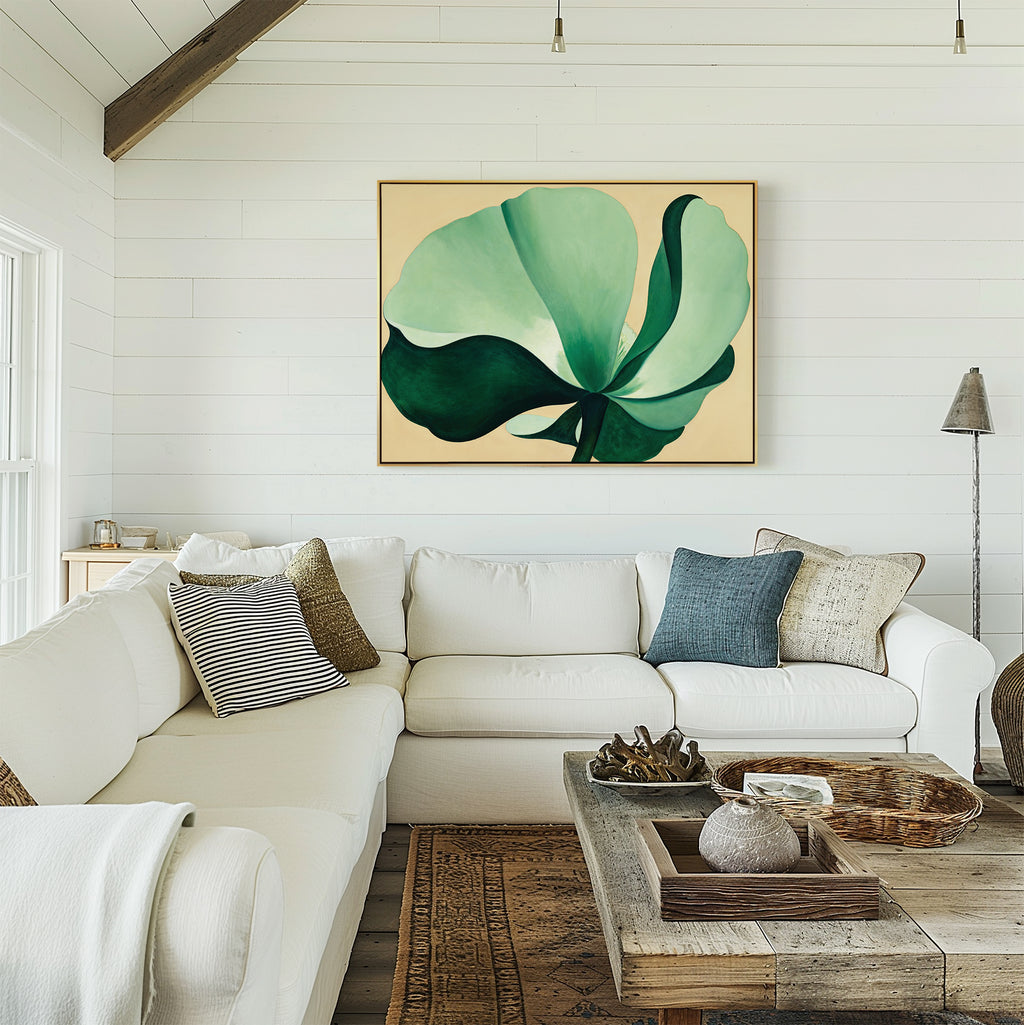 A cozy living room with a white sectional sofa, patterned pillows, a rustic wooden coffee table, and the Tropical Serenity Canvas Art - Horizontal showcasing abstract green and blue botanicals on the white shiplap wall.
